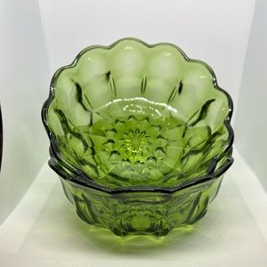 Two vintage green glass bowls.